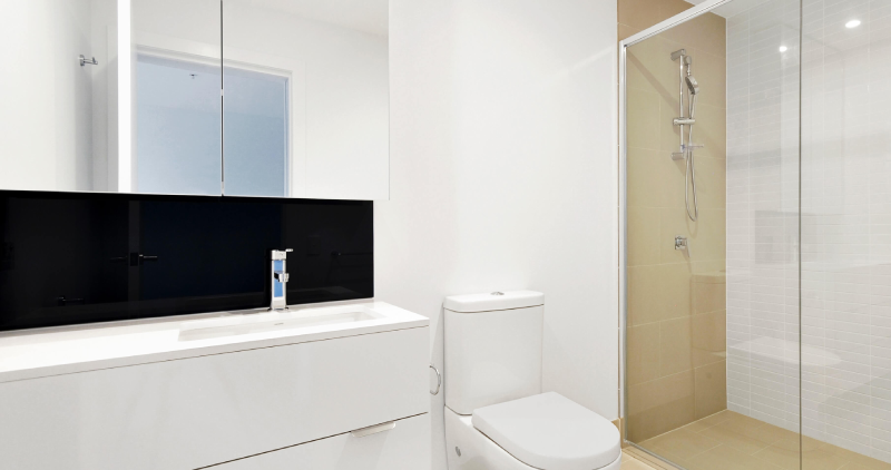 Well maintained plastic bathroom cladding on the walls around a bathroom