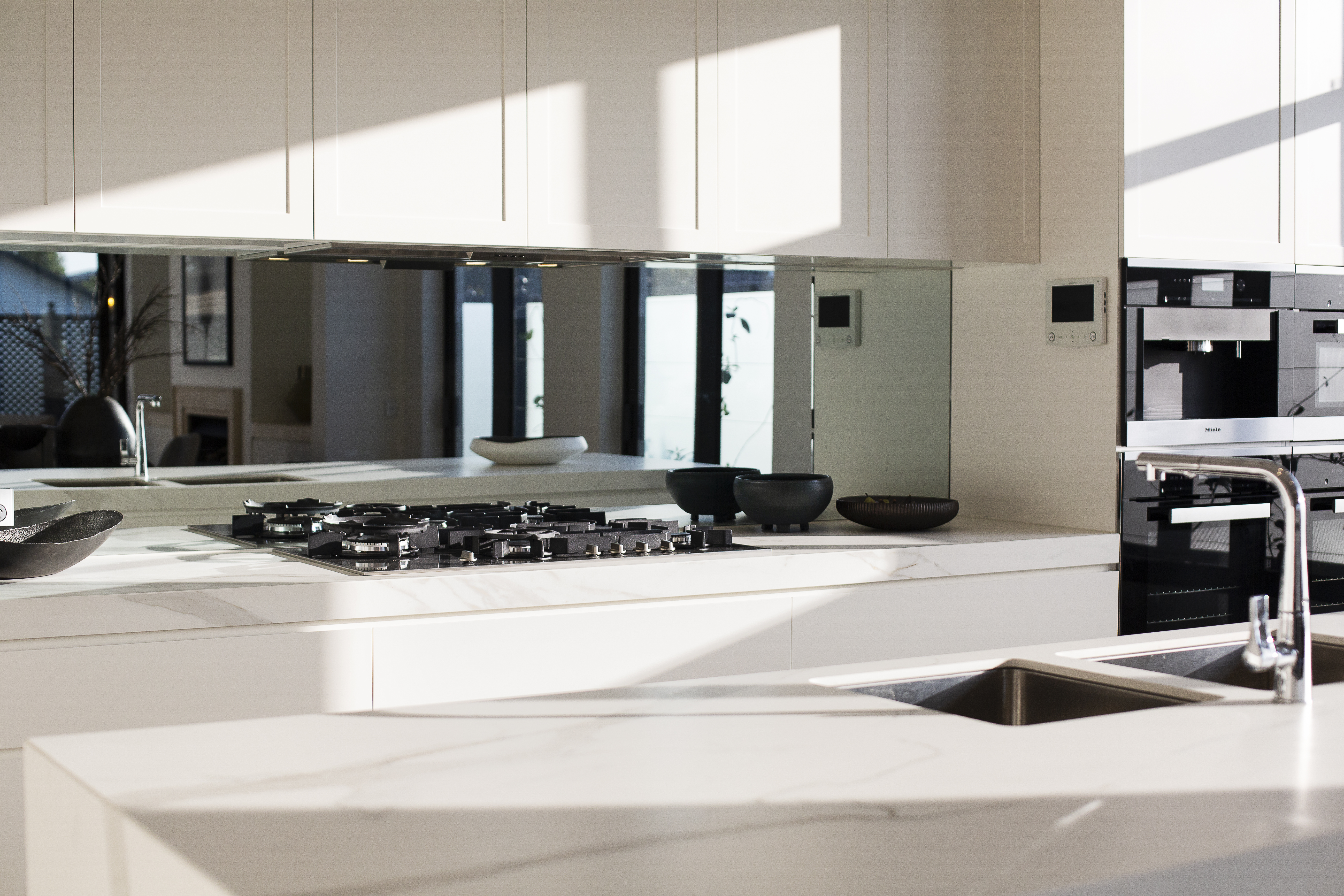 An installed acrylic splashback in a kitchen 